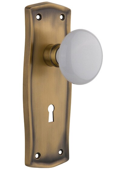Prairie Style Mortise Lock Set with White Porcelain Door Knobs in Antique Brass.